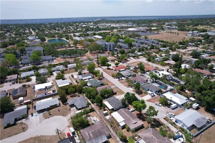 Aerial view featuring a water view and a residential view