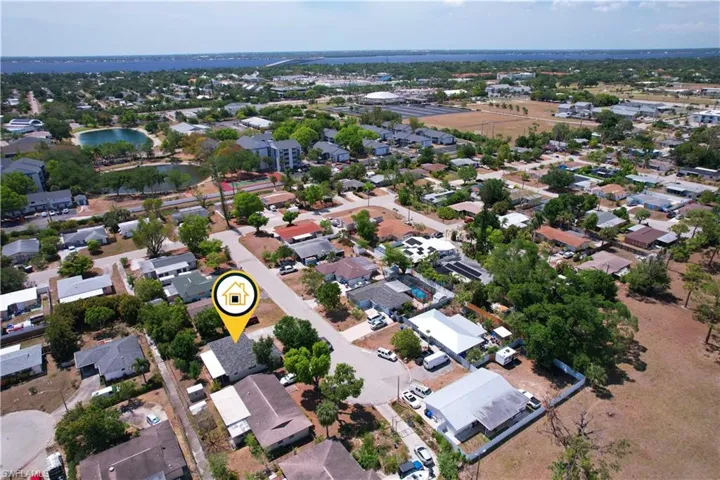 Drone / aerial view with a water view and a residential view
