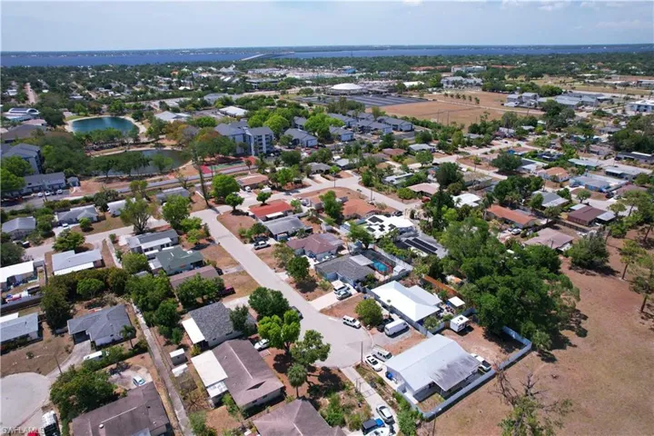 Bird's eye view featuring a water view and a residential view