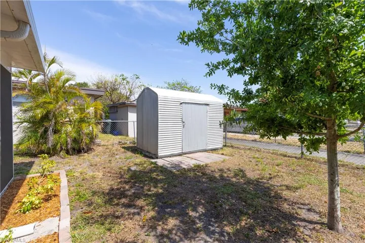 View of shed featuring a fenced backyard
