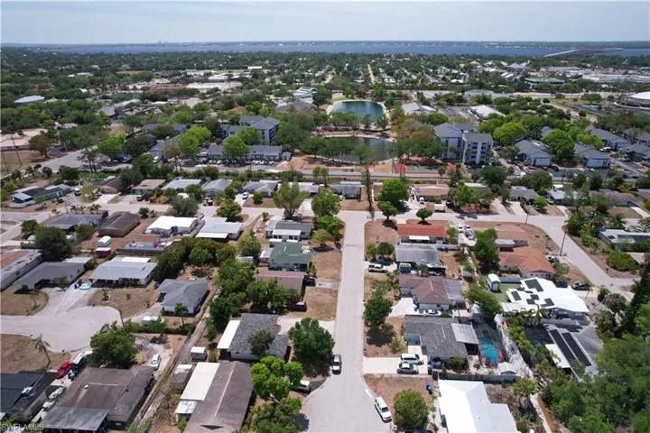 Drone / aerial view featuring a water view and a residential view