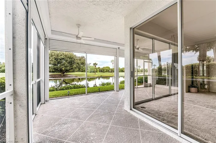 L-shaped lanai is protected with newer hurricane shutters