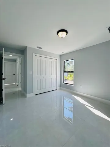 Unfurnished bedroom with a closet