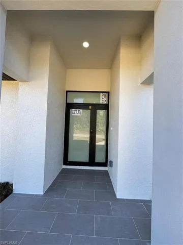 Doorway to property featuring french doors