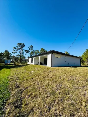 View of home's exterior featuring a yard