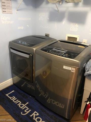 Indoor laundry includes washer and dryer.