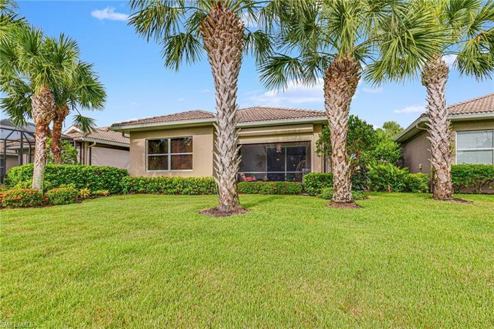 BEAUTIFUL VIEW OF THE BACK OF THE HOME WITH LUSH LANDSCAPING!