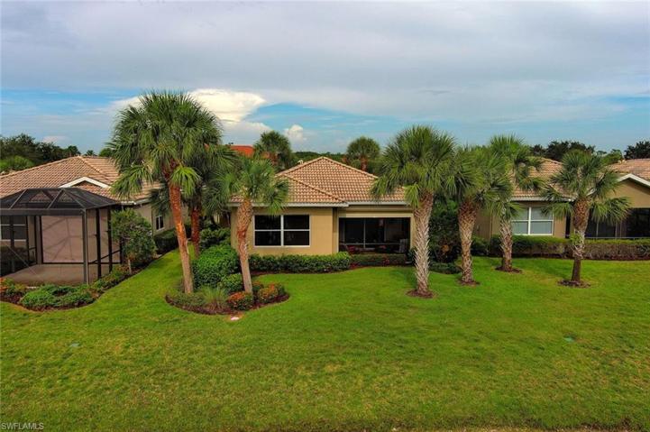 BEAUTIFUL LANDSCAPING WITH MATURE PALM TREES TO ENJOY!