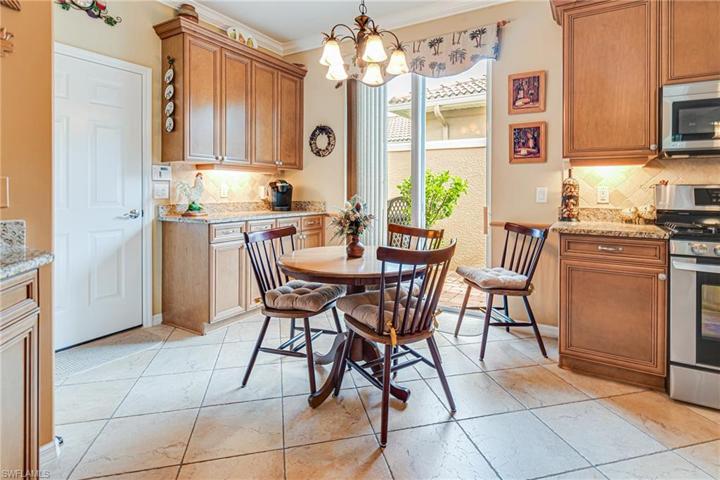 TONS OF COUNTER SPACE & CABINETS; PLUS A DOORWAY TO THE GRILLING & ENTERTAINMENT PATIO!