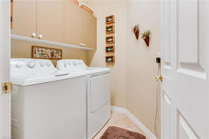 GE WASHER & DRYER ARE LESS THAN 1 YEAR OLD! ENTER THE GARAGE WHERE THERE IS A 2ND REFRIGERATOR, WORK BENCH & 1 CABINET W/ GARDEN TOOLS THAT ALL REMAIN WITH THE HOME!