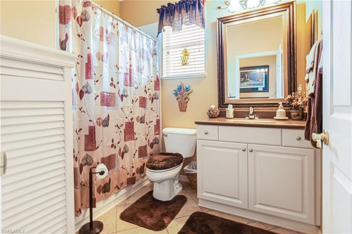 GUEST BATHROOM WITH UPDATED COUNTERTOP & UPDATED LIGHTING!