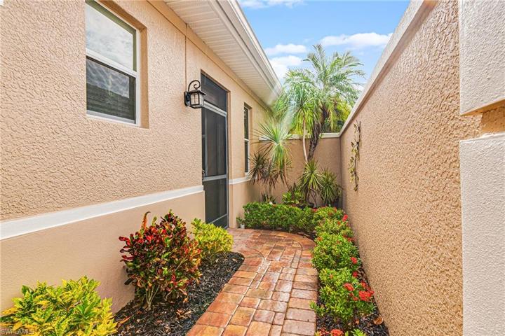 PAVERED ENTRYWAY WITH AMAZING LANDSCAPING!