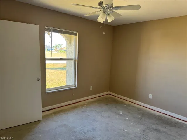 Garage with electric panel and a garage door opener