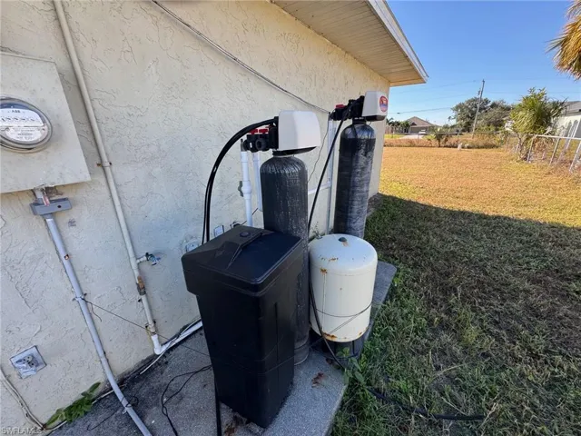 View of side of property featuring central air condition unit