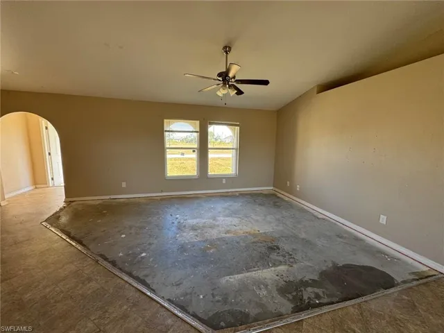 Unfurnished bedroom featuring ceiling fan and a closet