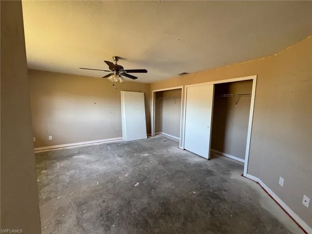 Unfurnished bedroom featuring ceiling fan and concrete flooring