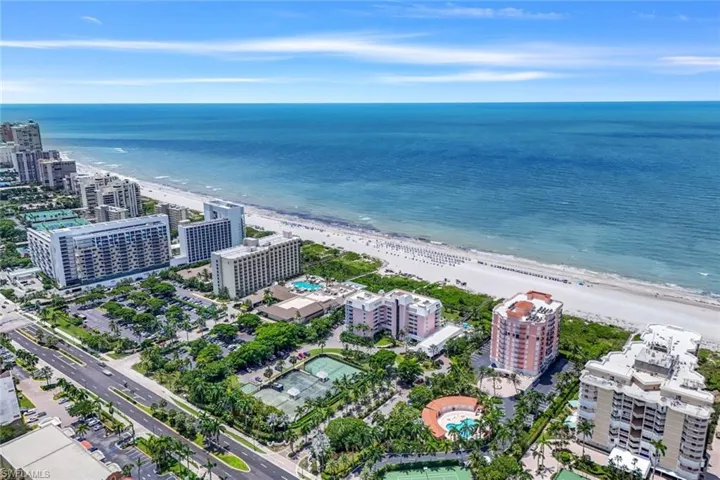 Drone / aerial view with a beach view and a water view
