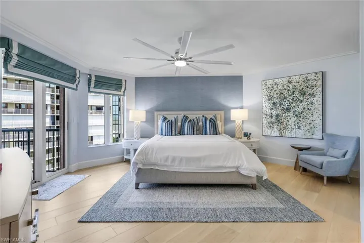 Bedroom with ceiling fan, light hardwood / wood-style flooring, access to outside, and crown molding
