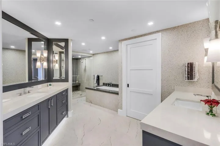 Bathroom with plus walk in shower and vanity
