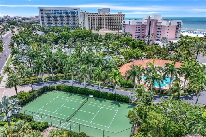 Birds eye view of property with a water view