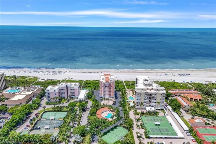 Drone / aerial view with a water view and a view of the beach