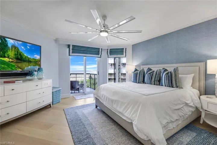 Bedroom with access to outside, light hardwood / wood-style flooring, ornamental molding, and ceiling fan
