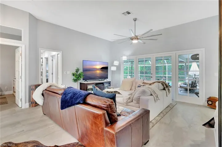 Living room featuring ceiling fan