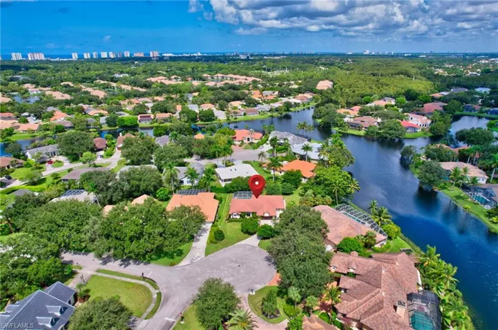 Birds eye view of property with a water view