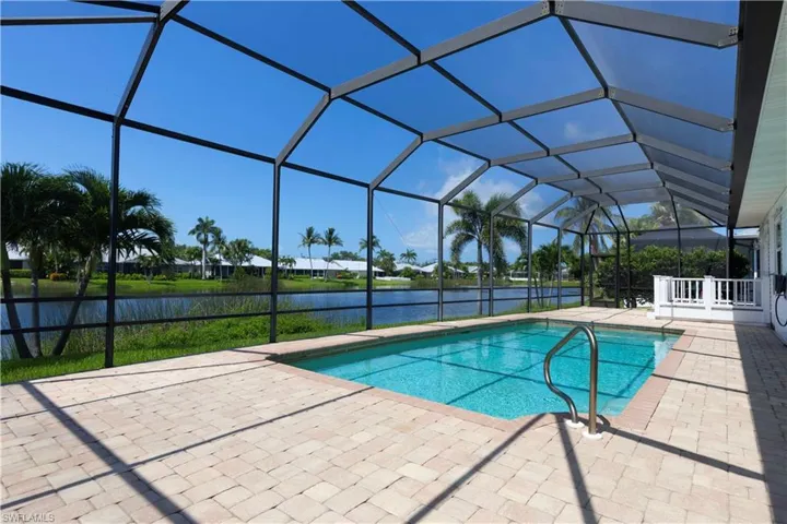 Swimming pool with a nice patio area, and water views