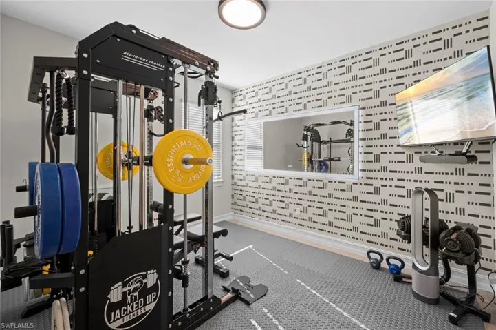 Exercise area with rubber floors and baseboards