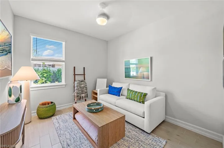 Living room featuring baseboards and light wood finished floors