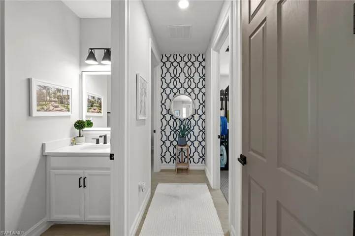 Bathroom featuring vanity and baseboards
