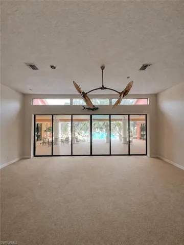 Digitally enhanced, Family room at the end of the foyer.