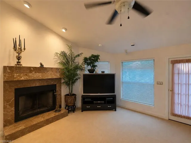 Digitally enhanced, Fireplace in primary bedroom.
