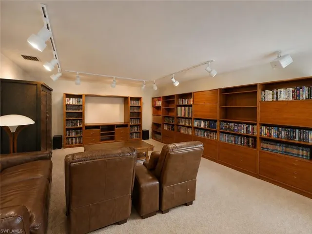 Digitally enhanced, Media room used as library and movie room.
