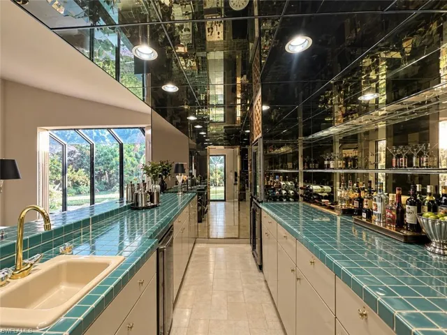 Digitally enhanced, Full size wet bar in the living area.