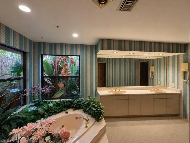 Digitally enhanced, Bathroom with jacuzzi and shower in the second wing of the house.