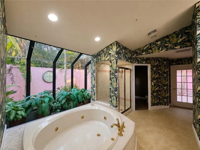 Digitally enhanced, Primary bathroom just off of the exercise and primary bedroom. Looking towards courtyard entrance.