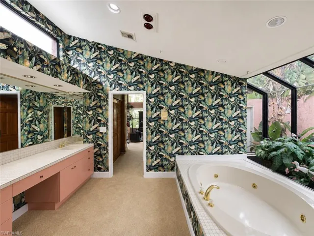 Digitally enhanced, Primary bathroom just off of the exercise and primary bedroom.