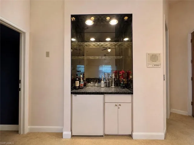 Digitally enhanced, Wet bar in primary bedroom.