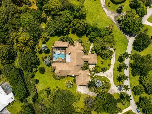Digitally enhanced, Drone view of the home and lot.