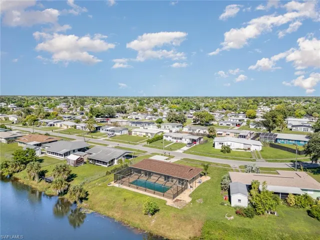 Aerial perspective of suburban area with a large body of water