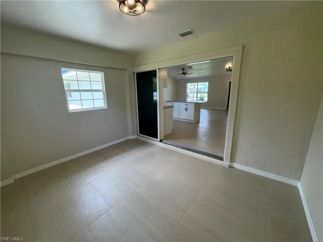 Enclosed lanai can be a den, office of TV room
