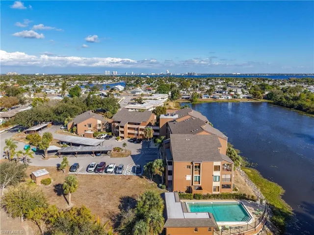 Aerial view of a nearby body of water and a pool area