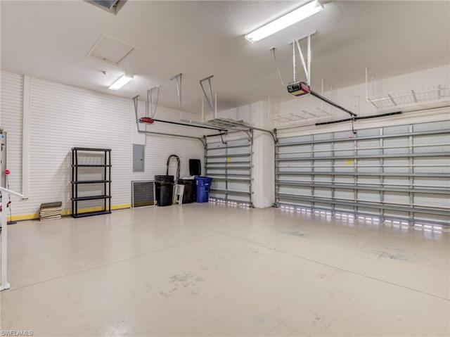 3-car garage with custom wall siding for clip-on storage