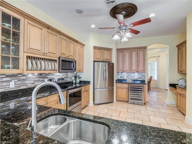Granite countertops with glass & stone backsplash