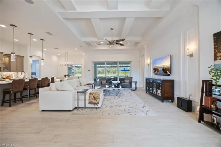 Coastal toned tile throughout the home and decorative wall molding in the living room