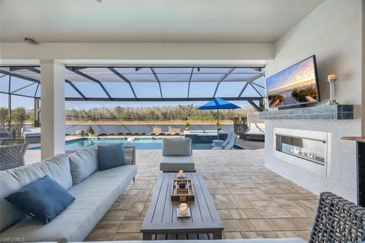 The covered patio is protected by motorized fabric storm panels
