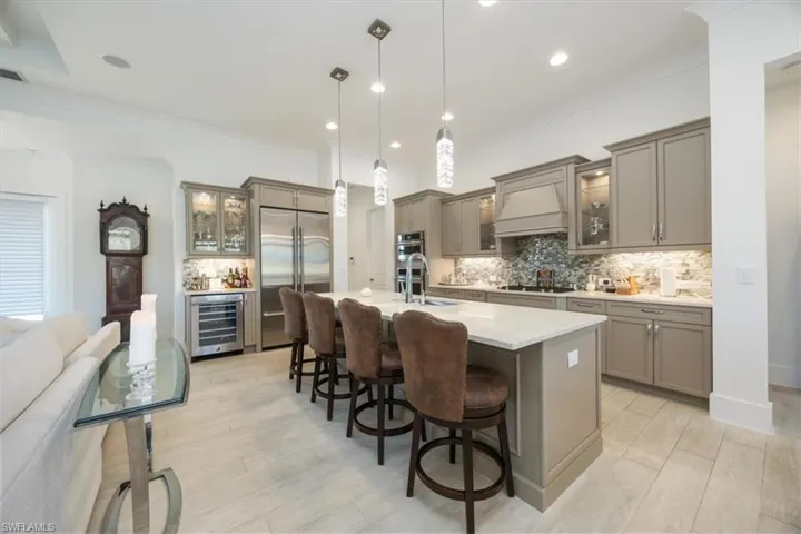 The quartz countertops and brilliant light fixtures and backsplash are just some of the many features that have been upgraded
