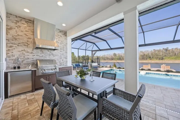 The outdoor kitchen and grill make dining al fresco so simple